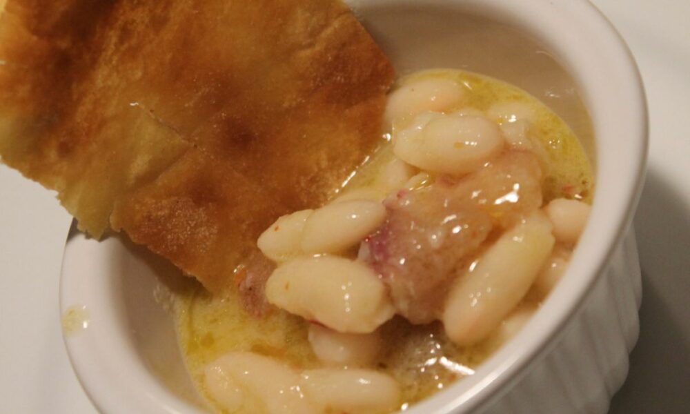 Traditional Italian Cefaletto fish from Orbetello served with creamy white beans, authentic Tuscan seafood dish by Chef Carlotta