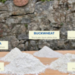 Five types of Italian flour for pasta making on a wooden board - Cooking with Carlotta