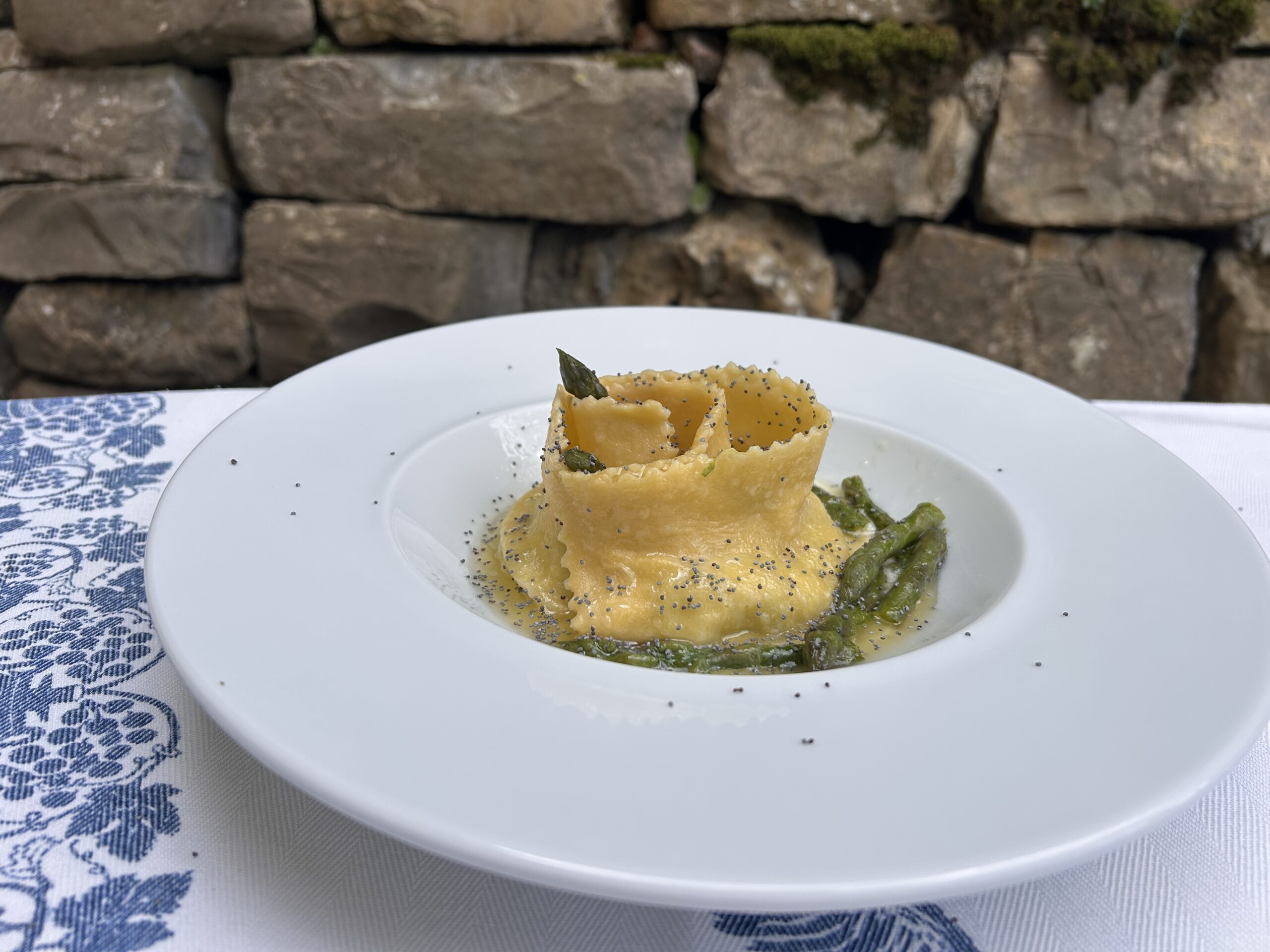 Handmade stuffed tagliatelle with asparagus and poppy seeds in Florence.